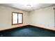 Cozy bedroom with a large window and green carpet flooring at 7333 State Road 42, Martinsville, IN 46151
