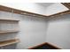 The closet boasts built-in wooden shelves, offering plenty of storage for organizing belongings at 7333 State Road 42, Martinsville, IN 46151