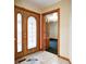 Elegant foyer with tile flooring, wooden trim, and an ornate glass front door at 7333 State Road 42, Martinsville, IN 46151