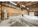 Spacious garage featuring unfinished walls, concrete floor, and ample room for storage and projects at 7333 State Road 42, Martinsville, IN 46151