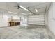Expansive garage featuring concrete flooring, work bench, and large door for versatile usage at 7333 State Road 42, Martinsville, IN 46151