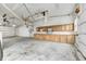 Spacious garage with built-in cabinetry, ample lighting, and concrete flooring, ideal for storage at 7333 State Road 42, Martinsville, IN 46151