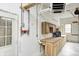 Spacious garage featuring a workbench, ample storage, and practical utility connections for various projects at 7333 State Road 42, Martinsville, IN 46151