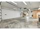 Spacious garage with abundant storage, bright lighting, and concrete flooring for versatile use at 7333 State Road 42, Martinsville, IN 46151
