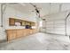 Garage featuring built-in cabinets, ample lighting, and concrete flooring for versatile storage and workspace at 7333 State Road 42, Martinsville, IN 46151