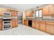 Bright eat-in kitchen with oak cabinets, a large window, stainless steel appliances, and a pantry at 7333 State Road 42, Martinsville, IN 46151