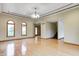 Bright living room featuring hardwood floors, modern lighting, and arched windows at 7333 State Road 42, Martinsville, IN 46151