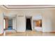Spacious room highlighting access to a staircase, kitchen, and beautifully trimmed doorway at 7333 State Road 42, Martinsville, IN 46151