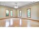 Spacious living room with hardwood floors, tray ceilings, and plenty of natural light at 7333 State Road 42, Martinsville, IN 46151