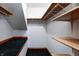 Walk-in closet featuring carpeted floor and multiple storage shelves at 7333 State Road 42, Martinsville, IN 46151
