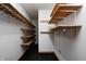 Spacious walk-in closet features custom wood shelving and ample storage space for organization at 7333 State Road 42, Martinsville, IN 46151