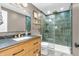 Modern bathroom featuring a glass-enclosed shower, sleek vanity, and stylish fixtures at 7633 Janean Dr, Brownsburg, IN 46112