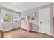 Charming bedroom with hardwood floors, bright window, and a pink dresser at 7633 Janean Dr, Brownsburg, IN 46112