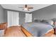 Bedroom with modern design, ceiling fan, and calming gray walls at 7633 Janean Dr, Brownsburg, IN 46112