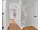 Hallway featuring wood floors and leading to multiple rooms at 7633 Janean Dr, Brownsburg, IN 46112