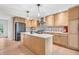 Bright, updated kitchen with stainless steel appliances, custom backsplash, and large island at 7633 Janean Dr, Brownsburg, IN 46112
