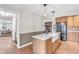 Beautiful kitchen with island sink, stainless appliances, and an open floor plan at 7633 Janean Dr, Brownsburg, IN 46112