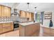 Open concept kitchen with stainless steel appliances and natural light at 7633 Janean Dr, Brownsburg, IN 46112