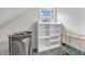 Bright storage area with shelving, laundry basket, and convenient rolling cart at 7633 Janean Dr, Brownsburg, IN 46112