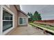 Backyard with a wooden deck and bench overlooking the lawn and wooden privacy fence at 7859 Chesapeake E Dr, Indianapolis, IN 46236