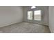 Neutral bedroom with carpet flooring and natural light provided by large windows at 7859 Chesapeake E Dr, Indianapolis, IN 46236