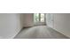 This bedroom offers natural light from windows, complemented by neutral walls and plush carpeting at 7859 Chesapeake E Dr, Indianapolis, IN 46236