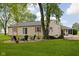Landscaped backyard with fire pit and outdoor seating perfect for entertaining at 7990 S County Road 200 E, Pittsboro, IN 46167