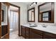 Bathroom with a double sink vanity, tile flooring, and a shower/tub combination at 7990 S County Road 200 E, Pittsboro, IN 46167