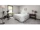 Comfortable bedroom featuring a bed, exercise bike, and side tables with lamps at 7990 S County Road 200 E, Pittsboro, IN 46167