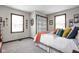 Bright bedroom with lots of natural light, a bed, throw blanket, and decorative pillows at 7990 S County Road 200 E, Pittsboro, IN 46167