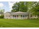 Charming ranch-style home with a covered porch and spacious front yard, perfect for outdoor activities at 7990 S County Road 200 E, Pittsboro, IN 46167