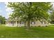 Attractive home with a lovely yard and a cozy front porch, creating a warm and inviting atmosphere at 7990 S County Road 200 E, Pittsboro, IN 46167