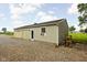 A detached two-car garage with an exterior door and an AC unit in the window at 7990 S County Road 200 E, Pittsboro, IN 46167