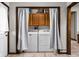 Laundry room with washer and dryer, overhead cabinetry, and tile flooring at 7990 S County Road 200 E, Pittsboro, IN 46167