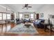 Bright and airy living room with hardwood floors, furnished with plush sofas and stylish decor at 7990 S County Road 200 E, Pittsboro, IN 46167