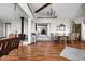 Open-concept living space with hardwood floors, showcasing a dining area and a wood-burning stove at 7990 S County Road 200 E, Pittsboro, IN 46167