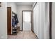 Entryway with coat rack, bench, shoe storage, and tile flooring at 7990 S County Road 200 E, Pittsboro, IN 46167
