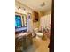 Bathroom includes flower shower curtain and vanity with granite top at 8123 Summertree Ct, Indianapolis, IN 46256