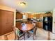 Kitchen includes wood cabinets, matching appliances, and tile floors for modern touch at 8123 Summertree Ct, Indianapolis, IN 46256