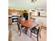 Well-lit kitchen offers lots of cabinets, open concept to living area, and appliances at 8123 Summertree Ct, Indianapolis, IN 46256
