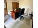 Cozy home office featuring a functional desk, rolling office chair, and practical setup for productivity and organization at 8123 Summertree Ct, Indianapolis, IN 46256