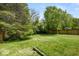 A large, fenced backyard offers plenty of space for outdoor activities and privacy at 8446 S Paddleboat Ln, Pendleton, IN 46064