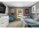 Bright bedroom with fun decor, featuring a window view and colorful accents at 8446 S Paddleboat Ln, Pendleton, IN 46064
