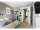 Cozy bedroom with organized shelving and a view into the hallway at 8446 S Paddleboat Ln, Pendleton, IN 46064