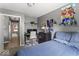 Bedroom featuring a full-size bed, neutral walls, desk, and anime artwork at 8446 S Paddleboat Ln, Pendleton, IN 46064