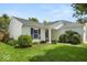 Charming home featuring white siding, black shutters, and a well-maintained front lawn at 8446 S Paddleboat Ln, Pendleton, IN 46064