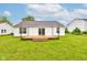 This backyard features a wooden deck and plenty of green space for outdoor activities at 8684 Captain Dr, Avon, IN 46123