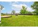 The property offers a large backyard, featuring a wood deck and ample space to play at 8684 Captain Dr, Avon, IN 46123