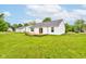 This home features a wood deck, an ample grass area, and a clean, white exterior at 8684 Captain Dr, Avon, IN 46123