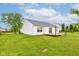 The backyard includes a wood deck, an ample grass area, and a home with white siding at 8684 Captain Dr, Avon, IN 46123